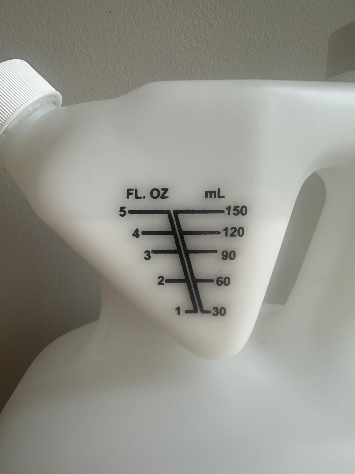 Measuring chamber on the Talstar One jug, marked 1 to 5 fluid ounces